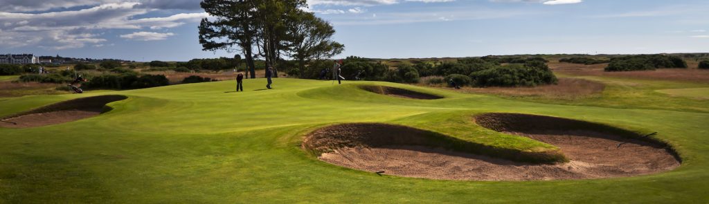 Panoramic view of the golf grounds and bunkers or sandtraps on the Championship Course at Carnoustie Golf Links. Hole 13.